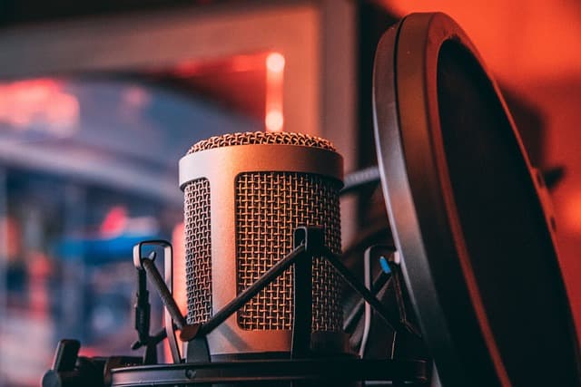 A microphone and headphones, representing the Heartfull Voices podcast.